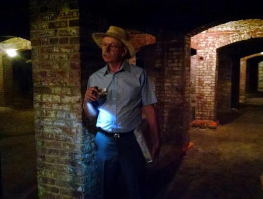Indiana Landmarks' tour guide and volunteer Craig Barker shares a story in the catacombs